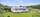 Pent opparbeidet uteområder med plen og buskvekster. . Bilde nummer 3 av 3
