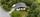 Eiendommen ligger usjenert til, omkranset av grøntarealer.. Bilde nummer 3 av 3