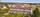 Rekkehusets sørside med private hager og umiddelbar nærhet til fellesarealer.. Bilde nummer 1 av 3