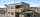 Fasadebildet - carport i tilknyttning til boligen. . Bilde nummer 2 av 3