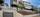 Et moderne rekkehus fra 2022 over tre plan, med en vedlikeholdsvennlig fasade i stående og liggende trepanel.. Bilde nummer 1 av 3