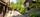 Meget pent opparbeidet tomt med steinlagte arealer, plen, busker og beplantning. . Bilde nummer 3 av 3